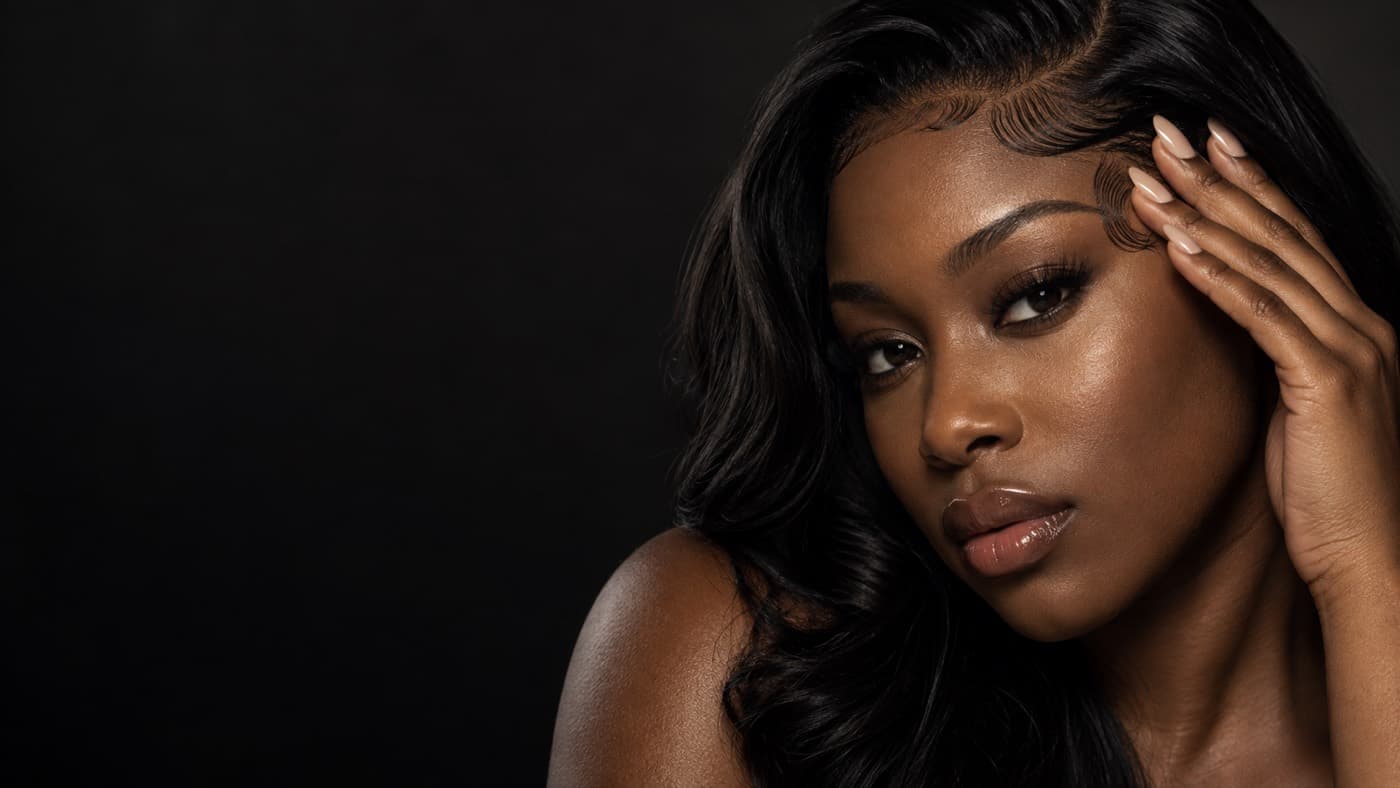 Close-up of a woman with a glossy styled hairline